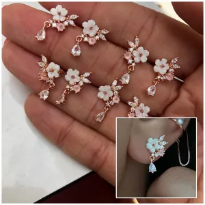 Dainty earring with pink stones and a flower