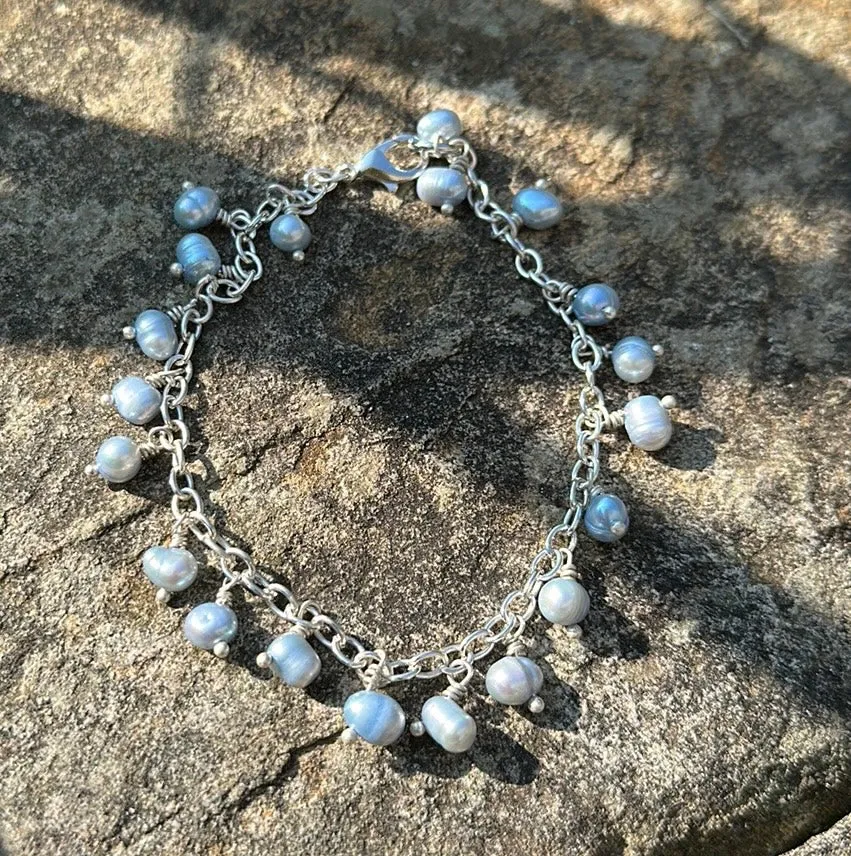 Icy blue pearl charm bracelet